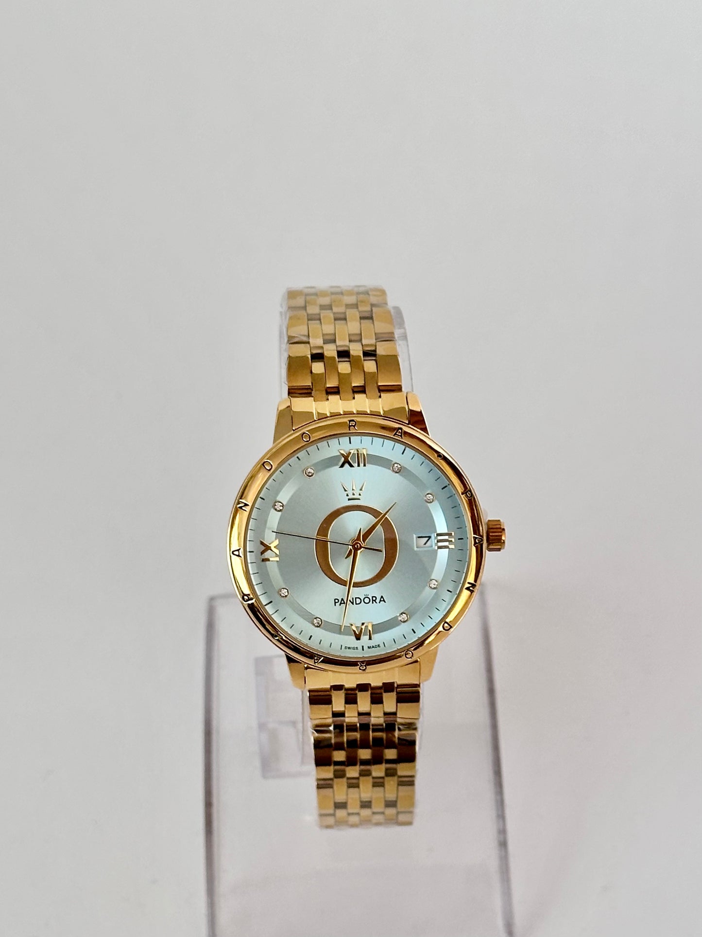 Reloj Pandora Dorado fondo azul