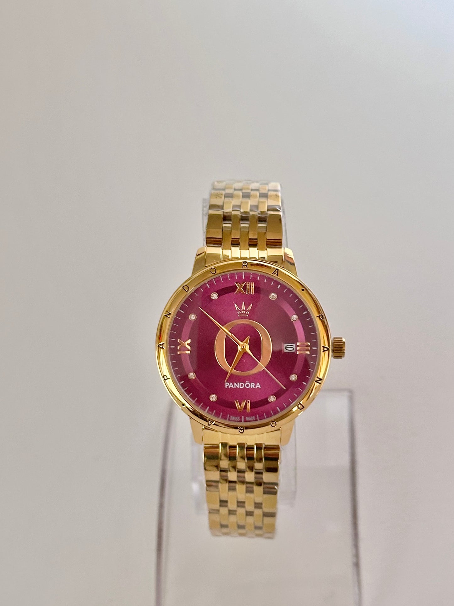 Reloj Pandora Dorado fondo Morado
