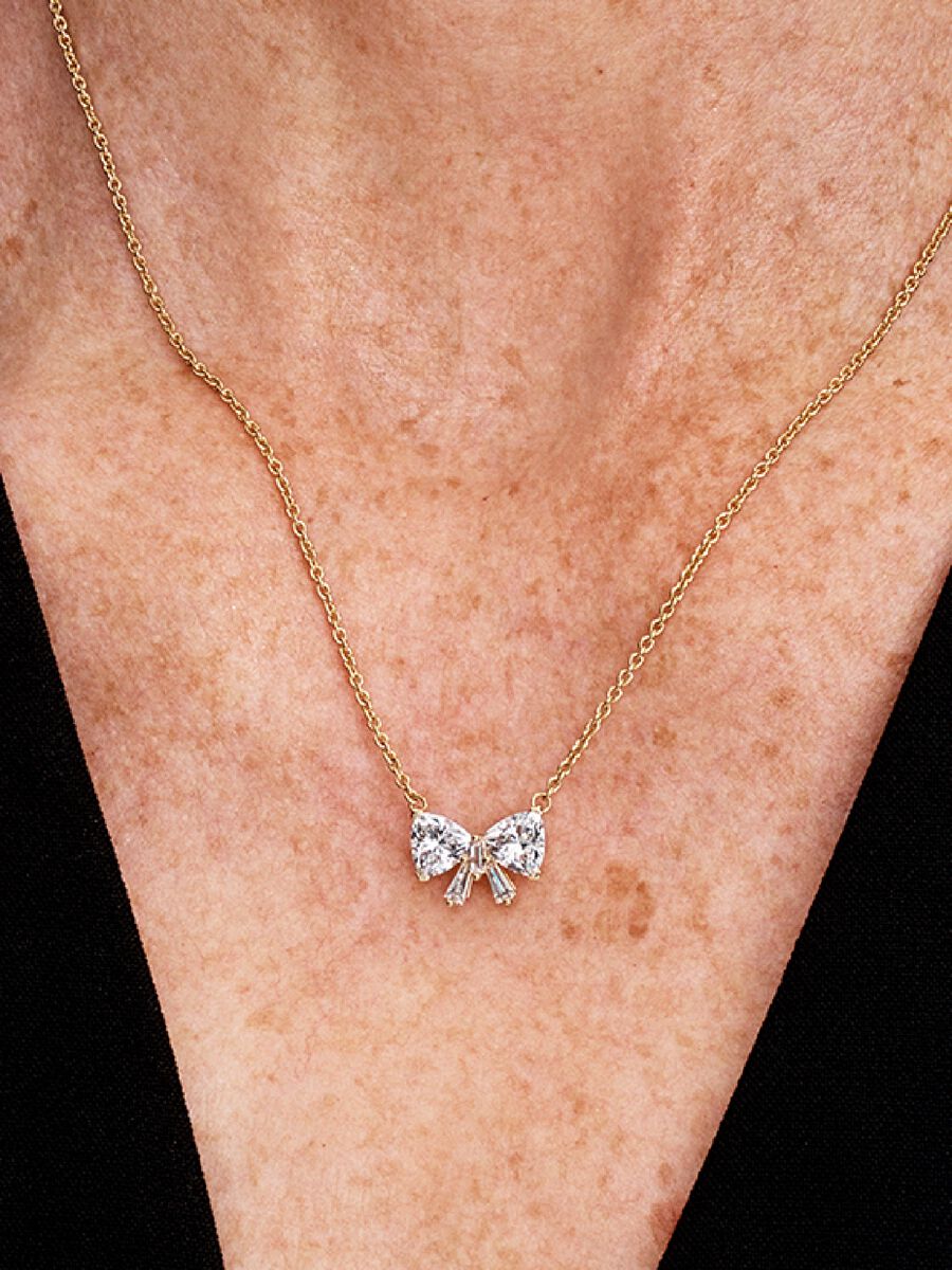 Conjunto Collar + aretes Lazo, Dorado